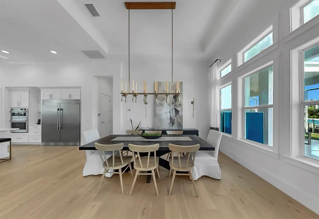 Dining room, Interior, Kitchen, Pendant Lights, Recessed Lighting, Stainless Steel Appliances, Wood Texture Flooring