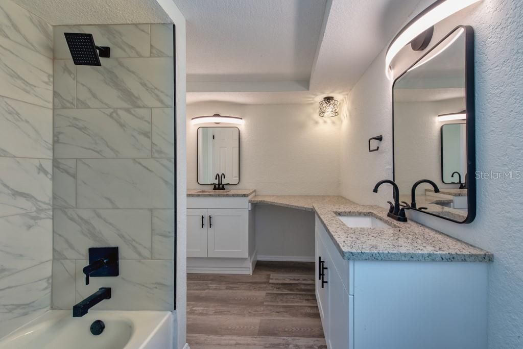 Bathroom, Dual Sink Vanities, Interior, Marble Walls, Wood Texture Flooring