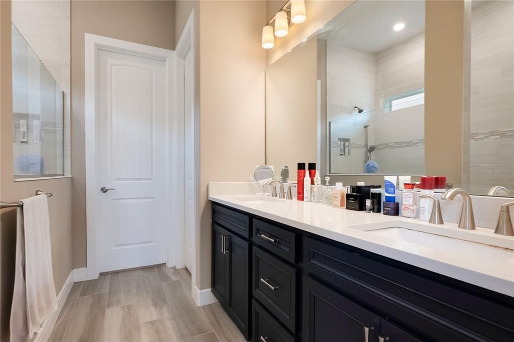 Bathroom, Dual Sink Vanities, Interior, Recessed Lighting, Wood Texture Flooring