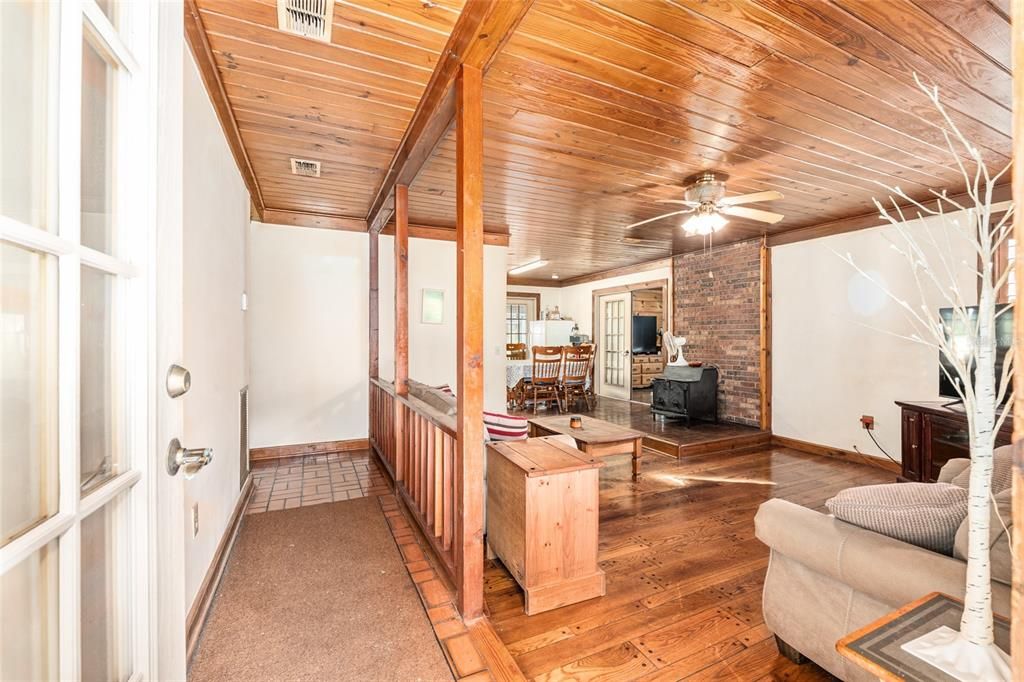 Dining room, Fireplace, Interior, Recessed Lighting, Stone Walls, Wooden Beams, Wooden Ceilings, Wood Texture Flooring