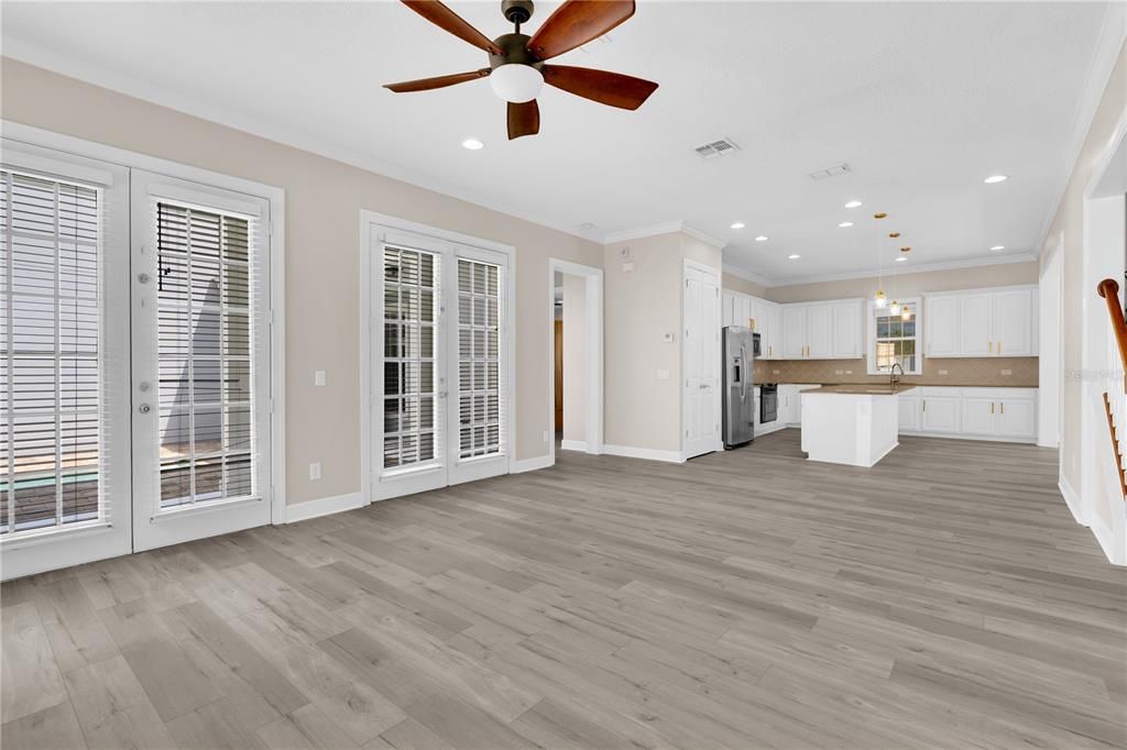 Empty room, Interior, Kitchen, Pendant Lights, Recessed Lighting, Stainless Steel Appliances, Wood Texture Flooring