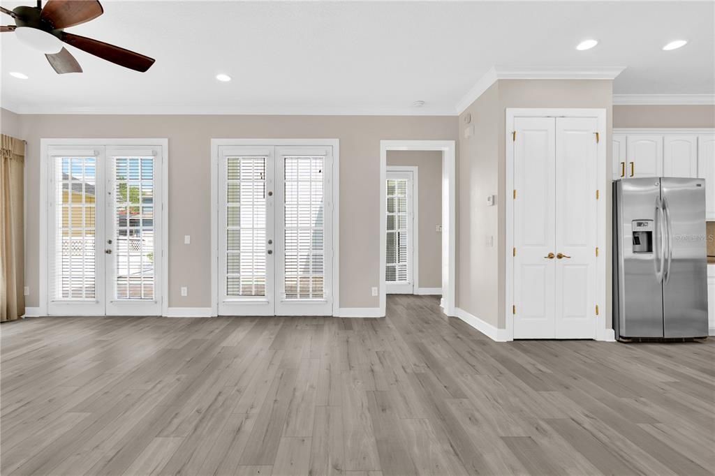 Empty room, Interior, Kitchen, Recessed Lighting, Stainless Steel Appliances, Wood Texture Flooring