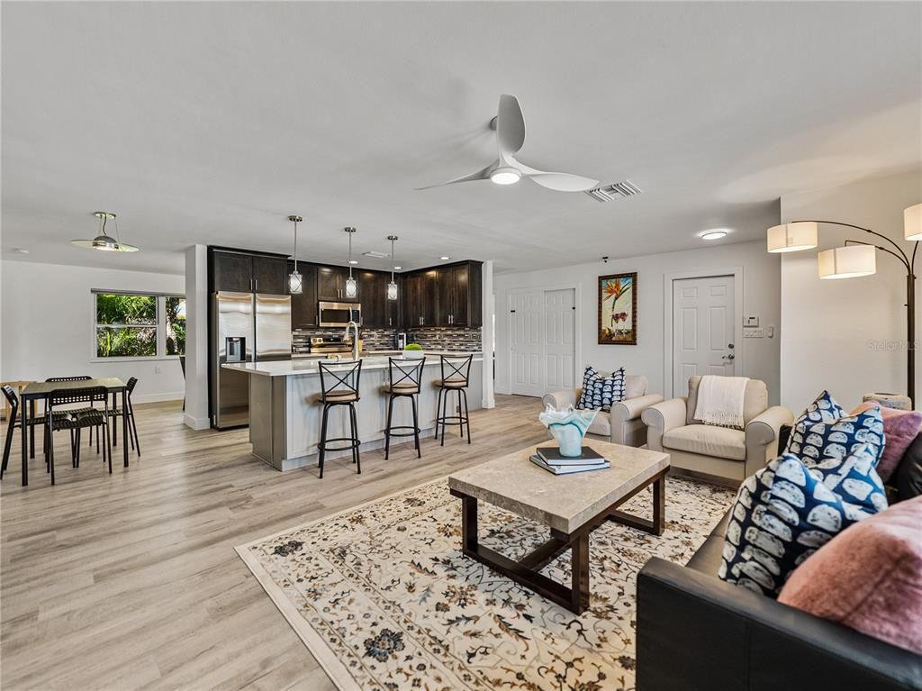 Dining room, Interior, Kitchen, Living room, Pendant Lights, Recessed Lighting, Stainless Steel Appliances, Wood Texture Flooring