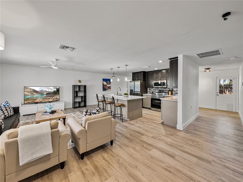 Dining room, Interior, Kitchen, Living room, Pendant Lights, Recessed Lighting, Stainless Steel Appliances, Wood Texture Flooring