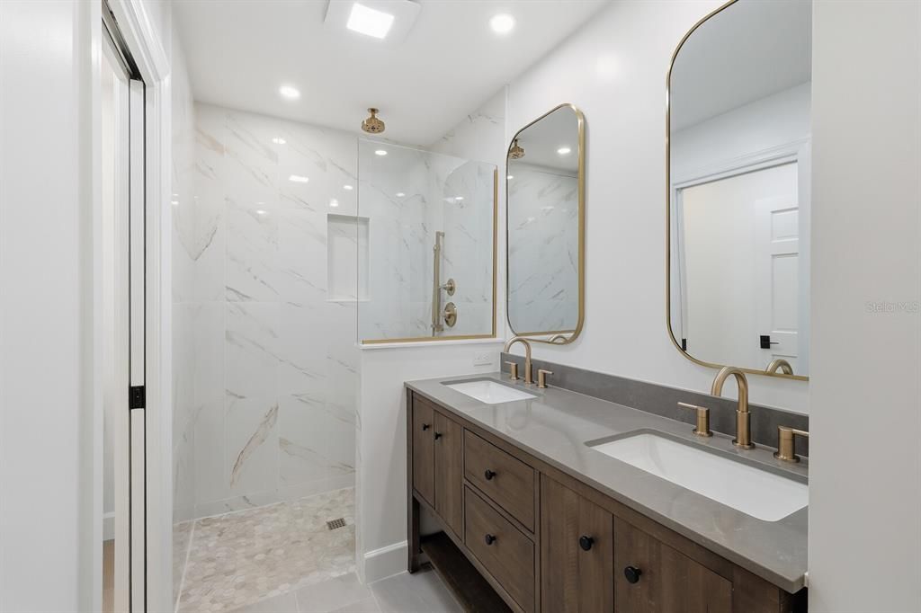 Bathroom, Dual Sink Vanities, Glass Shower, Interior, Marble Walls, Recessed Lighting