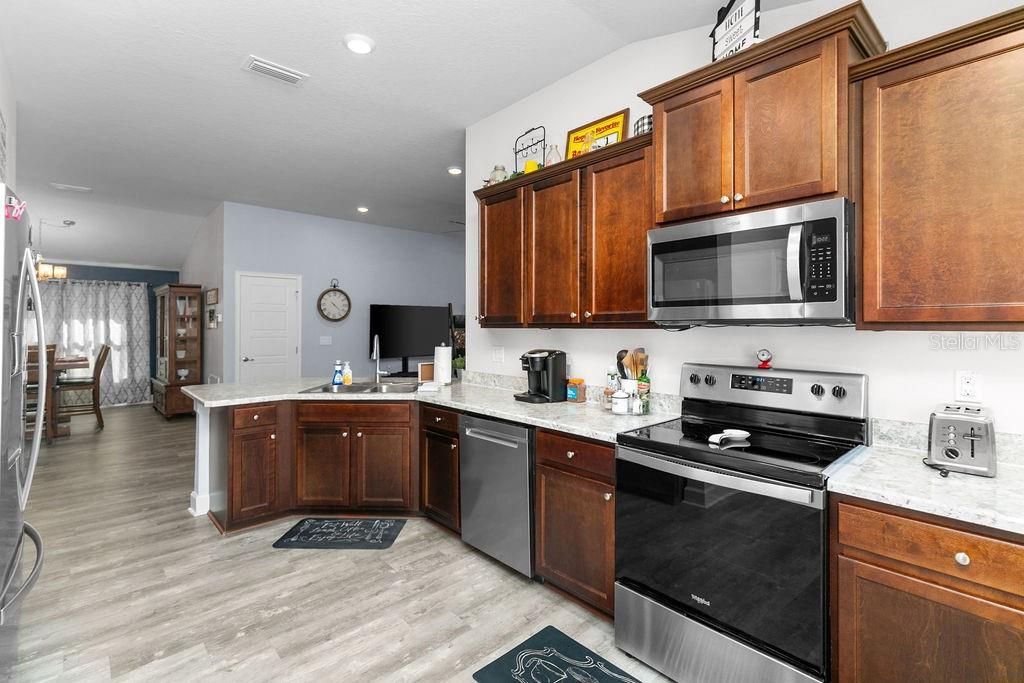 Interior, Kitchen, Recessed Lighting, Stainless Steel Appliances, Wood Texture Flooring