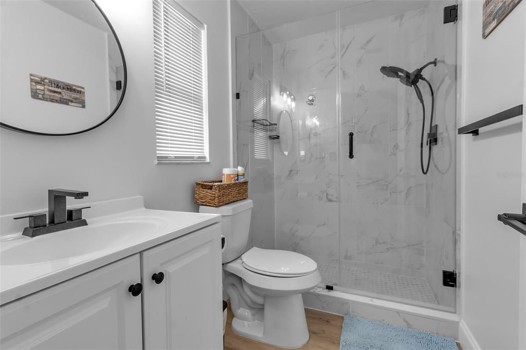 Bathroom, Glass Shower, Interior, Marble Walls, Wood Texture Flooring