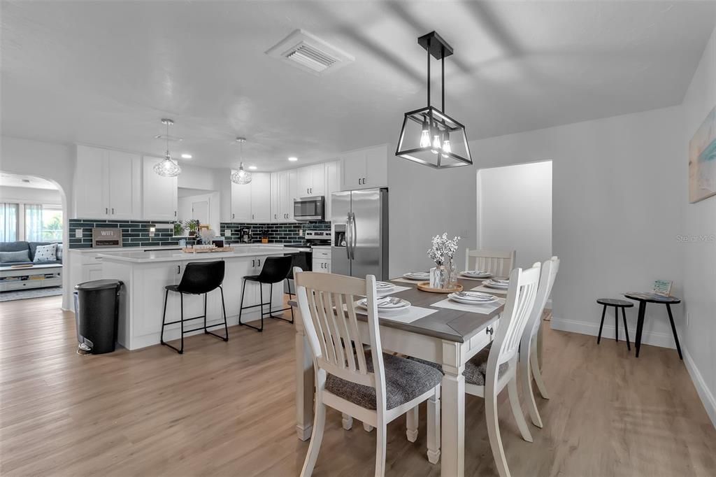 Dining room, Interior, Kitchen, Pendant Lights, Recessed Lighting, Stainless Steel Appliances, Wood Texture Flooring