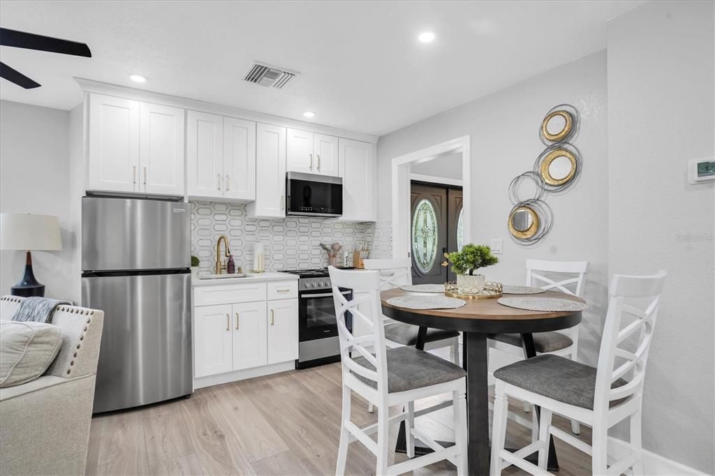 Dining room, Interior, Kitchen, Recessed Lighting, Stainless Steel Appliances, Wood Texture Flooring