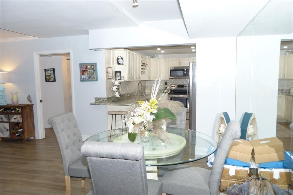 Dining room, Interior, Kitchen, Recessed Lighting, Stainless Steel Appliances, Wood Texture Flooring