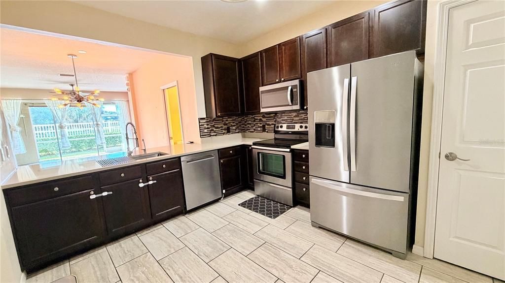 Interior, Kitchen, Recessed Lighting, Stainless Steel Appliances, Wood Texture Flooring