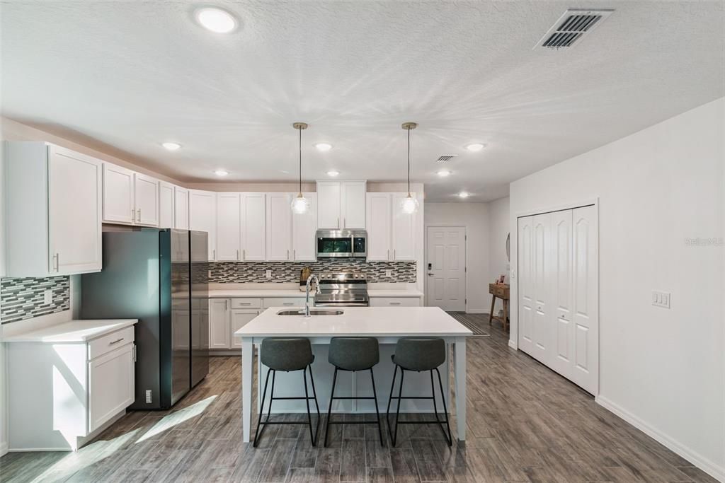 Interior, Kitchen, Pendant Lights, Recessed Lighting, Stainless Steel Appliances, Wood Texture Flooring