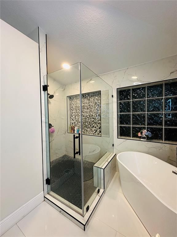 Bathroom, Free Standing Baths, Glass Shower, Interior, Marble Walls, Recessed Lighting