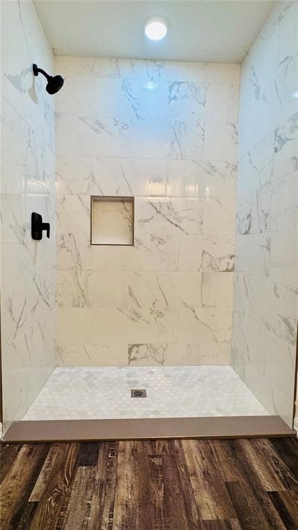 Bathroom, Glass Shower, Interior, Marble Walls, Recessed Lighting, Wood Texture Flooring