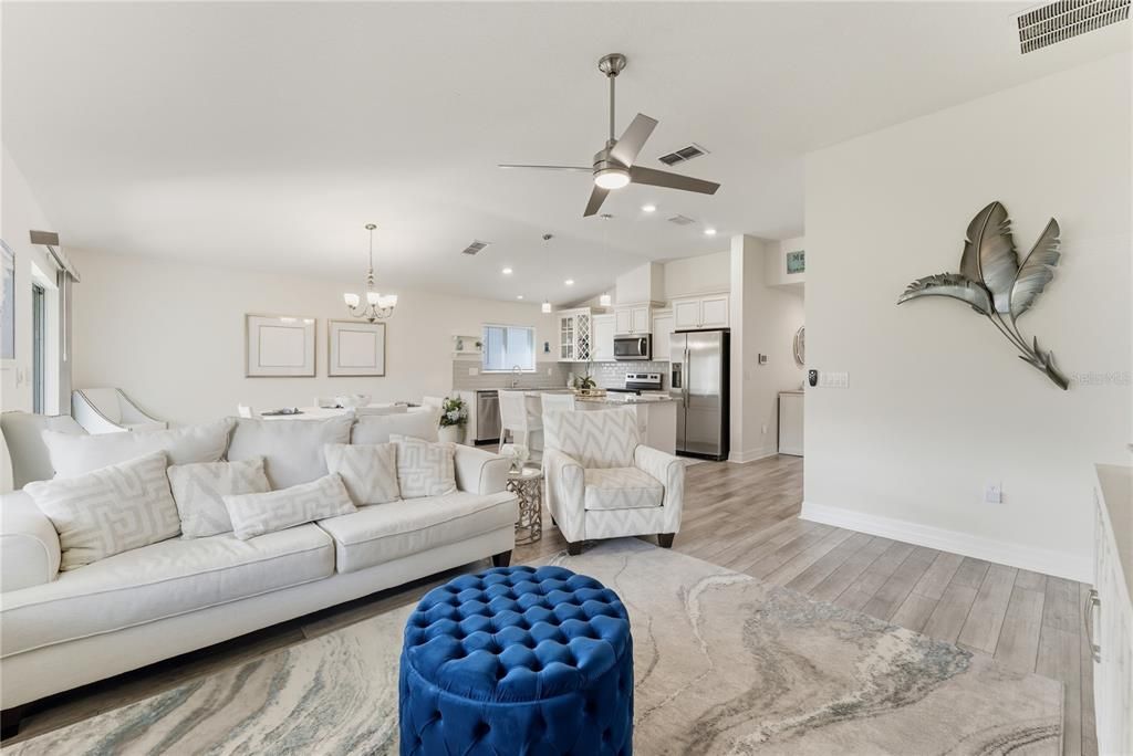 Chandelier, Dining room, Interior, Kitchen, Living room, Recessed Lighting, Stainless Steel Appliances, Wood Texture Flooring