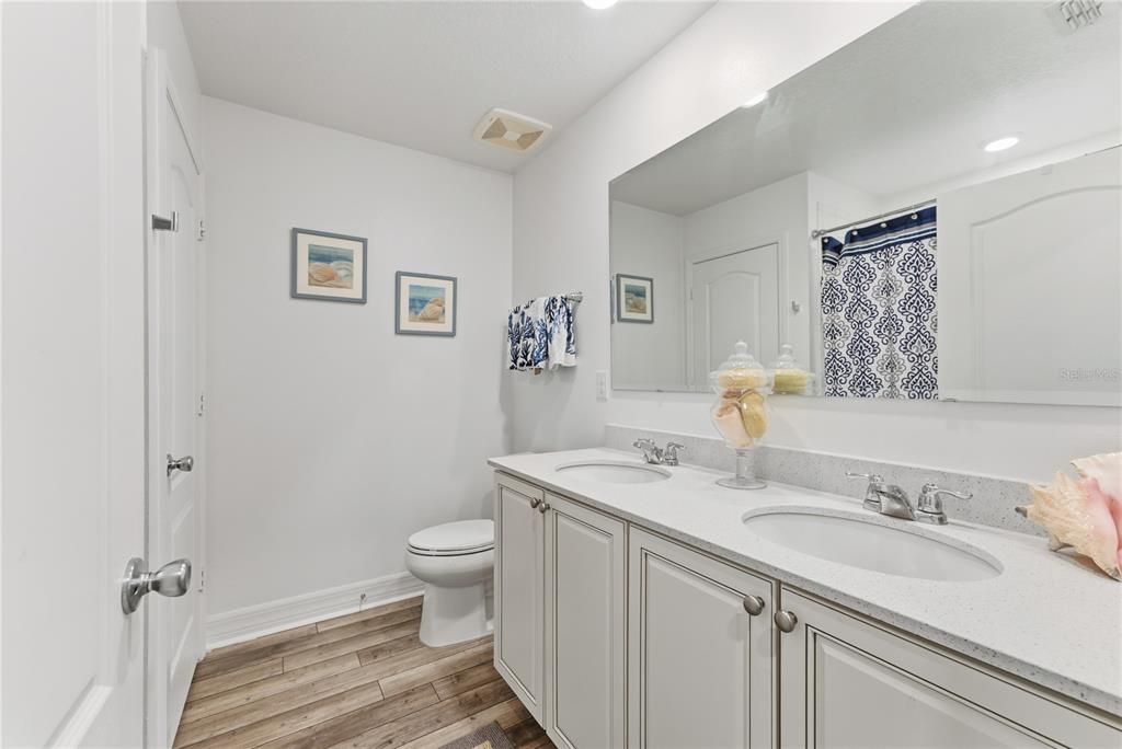 Bathroom, Dual Sink Vanities, Interior, Recessed Lighting, Wood Texture Flooring