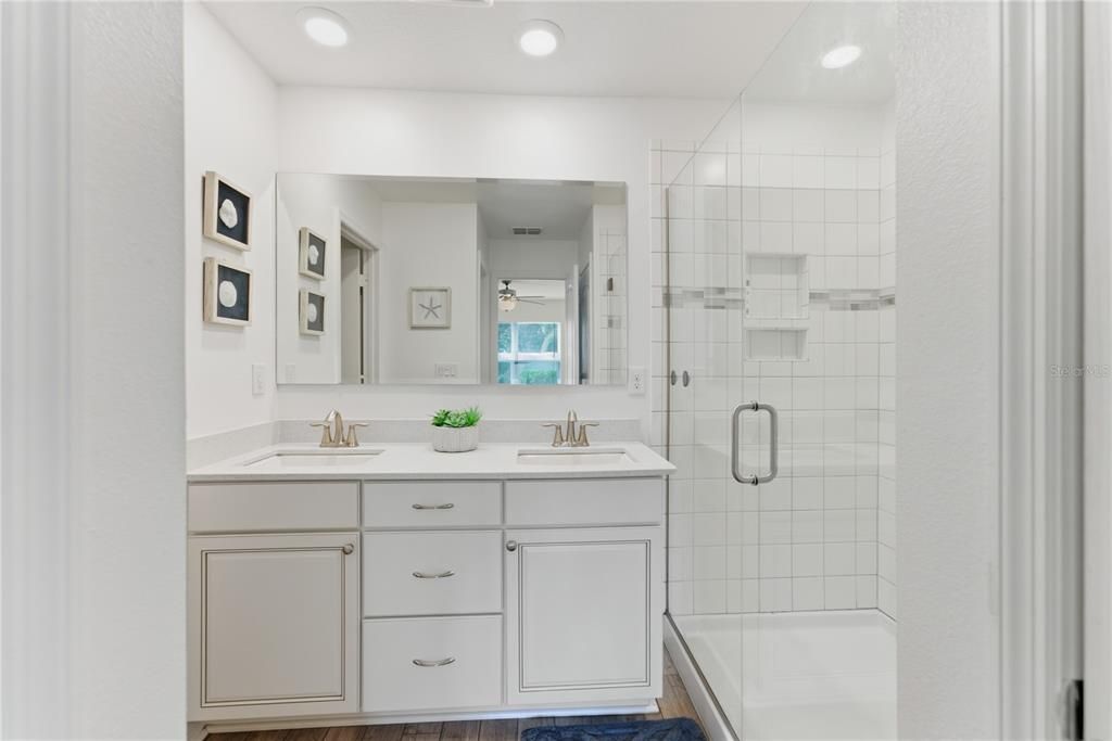 Bathroom, Dual Sink Vanities, Glass Shower, Interior, Recessed Lighting, Wood Texture Flooring