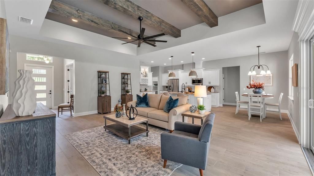 Chandelier, Dining room, Interior, Kitchen, Living room, Pendant Lights, Recessed Lighting, Stainless Steel Appliances, Wooden Beams, Wood Texture Flooring