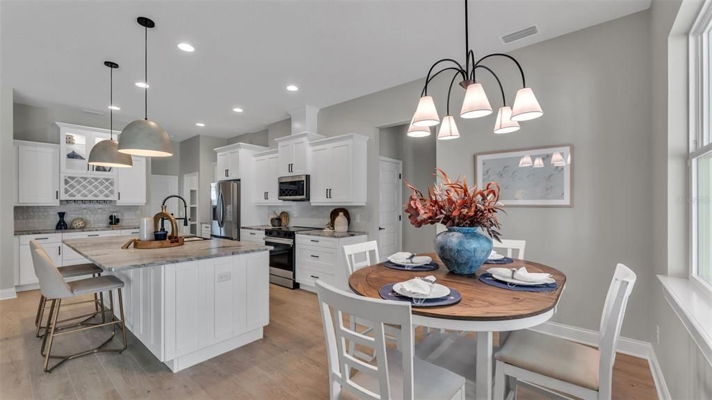 Dining room, Interior, Kitchen, Pendant Lights, Recessed Lighting, Stainless Steel Appliances, Wood Texture Flooring