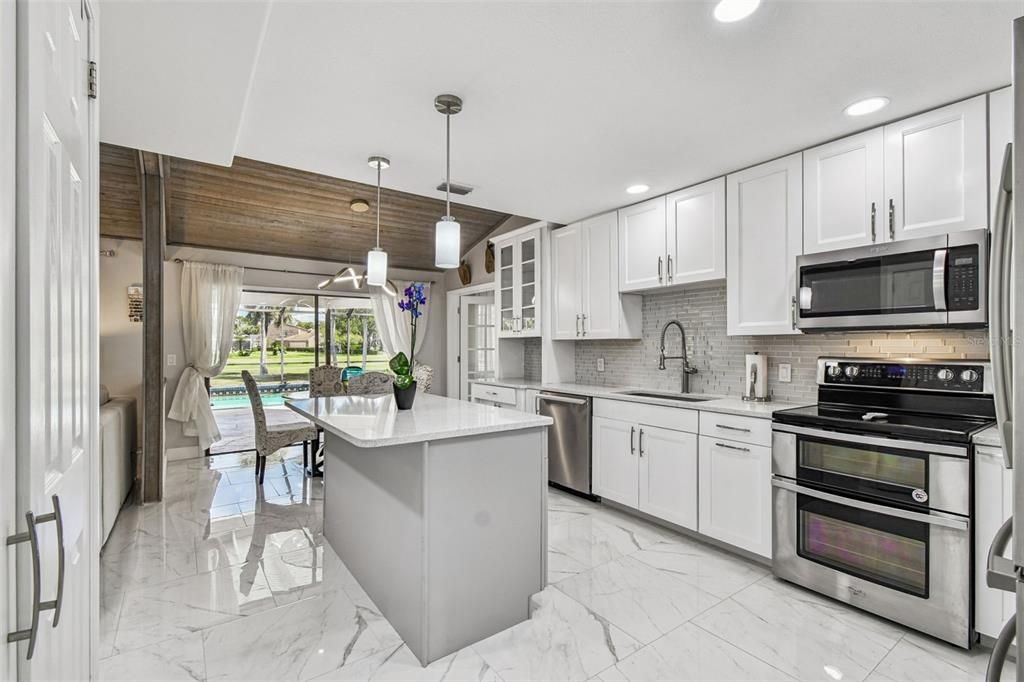 Dining room, Interior, Kitchen, Marble, Pendant Lights, Recessed Lighting, Stainless Steel Appliances, Wooden Ceilings