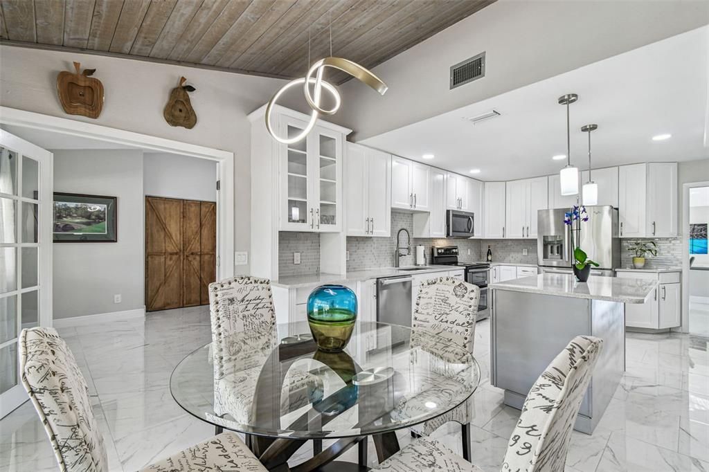 Dining room, Interior, Kitchen, Marble, Pendant Lights, Recessed Lighting, Stainless Steel Appliances, Wooden Ceilings