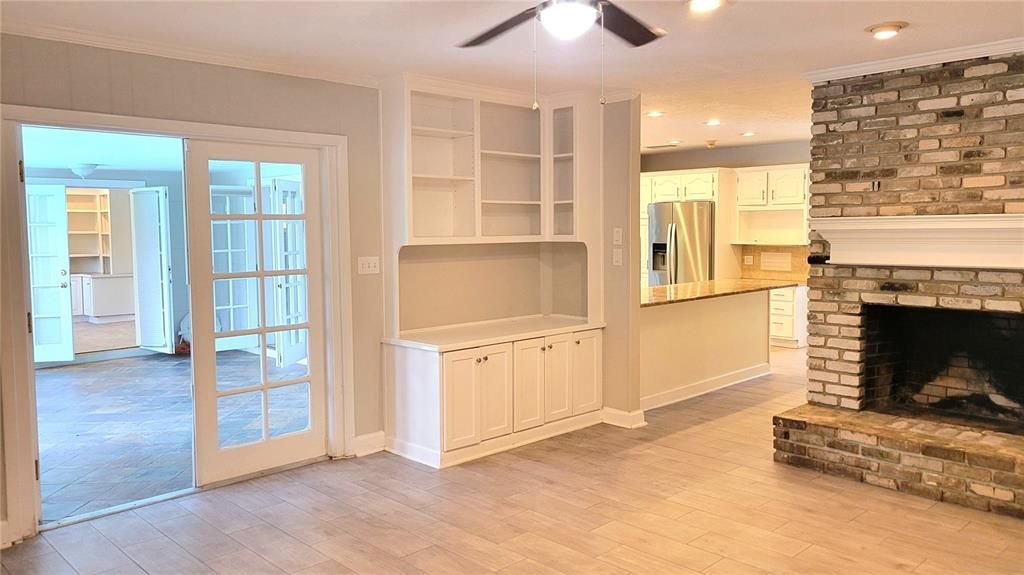 Fireplace, Interior, Kitchen, Recessed Lighting, Stainless Steel Appliances, Stone Walls, Wood Texture Flooring