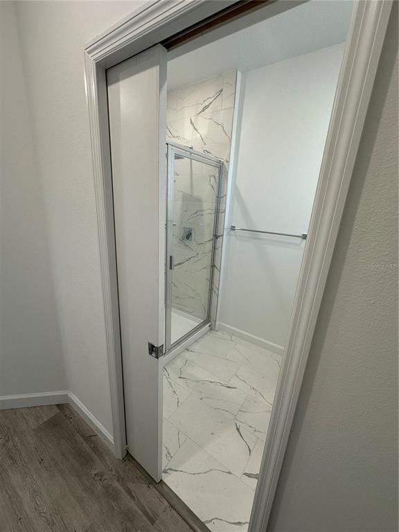 Bathroom, Glass Shower, Interior, Marble, Marble Walls, Wood Texture Flooring