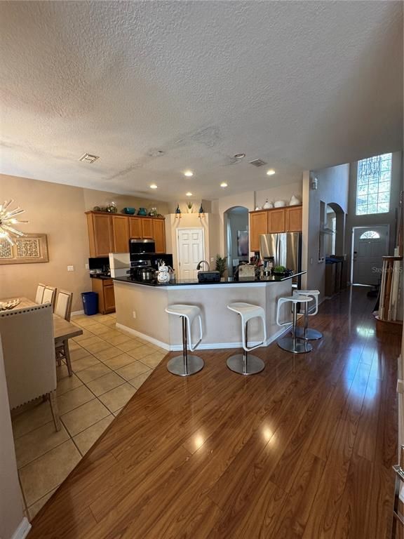 Dining room, Interior, Kitchen, Recessed Lighting, Stainless Steel Appliances, Wood Texture Flooring