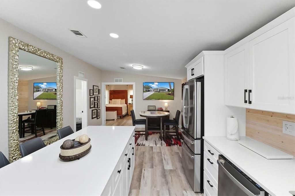 Dining room, Interior, Kitchen, Recessed Lighting, Stainless Steel Appliances, Wood Texture Flooring