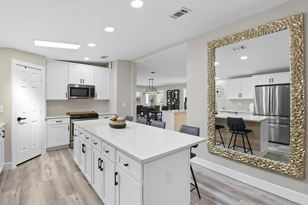 Dining room, Interior, Kitchen, Pendant Lights, Recessed Lighting, Stainless Steel Appliances, Wood Texture Flooring