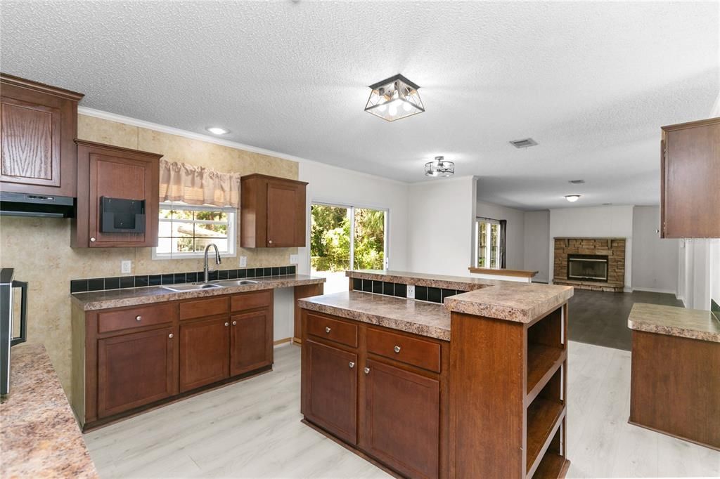 Fireplace, Interior, Kitchen, Recessed Lighting, Wood Texture Flooring