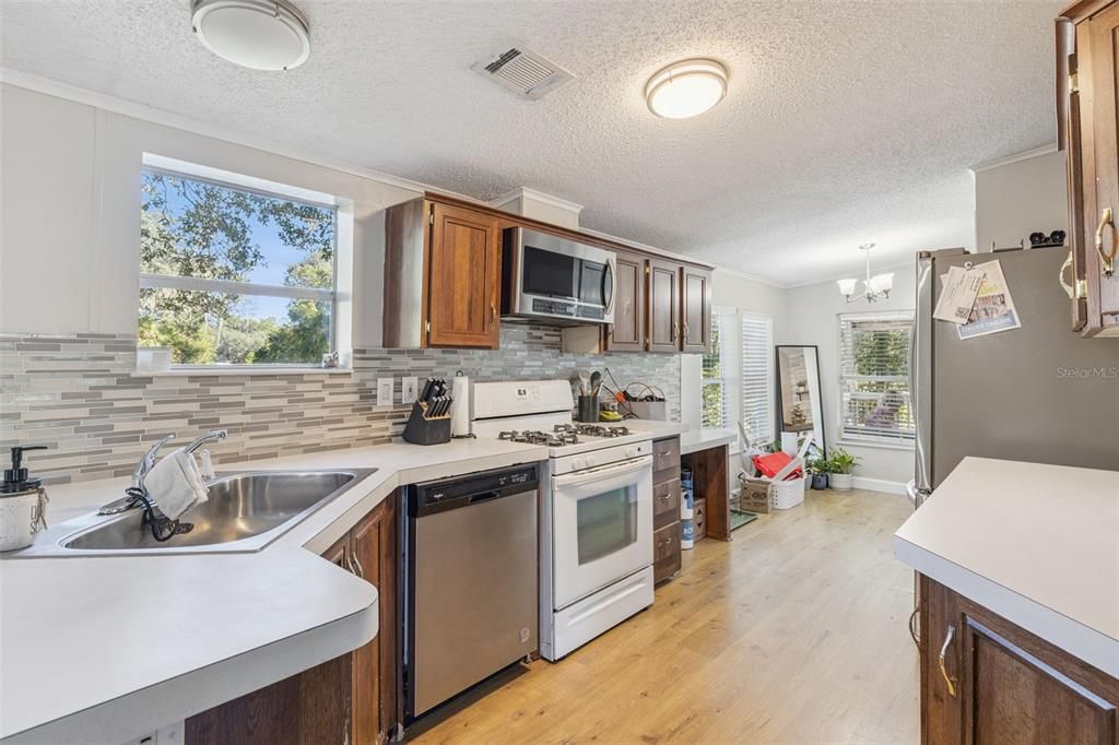 Chandelier, Interior, Kitchen, Stainless Steel Appliances, Wood Texture Flooring