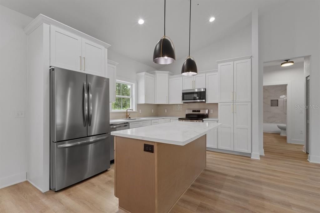 Interior, Kitchen, Pendant Lights, Recessed Lighting, Stainless Steel Appliances, Wood Texture Flooring