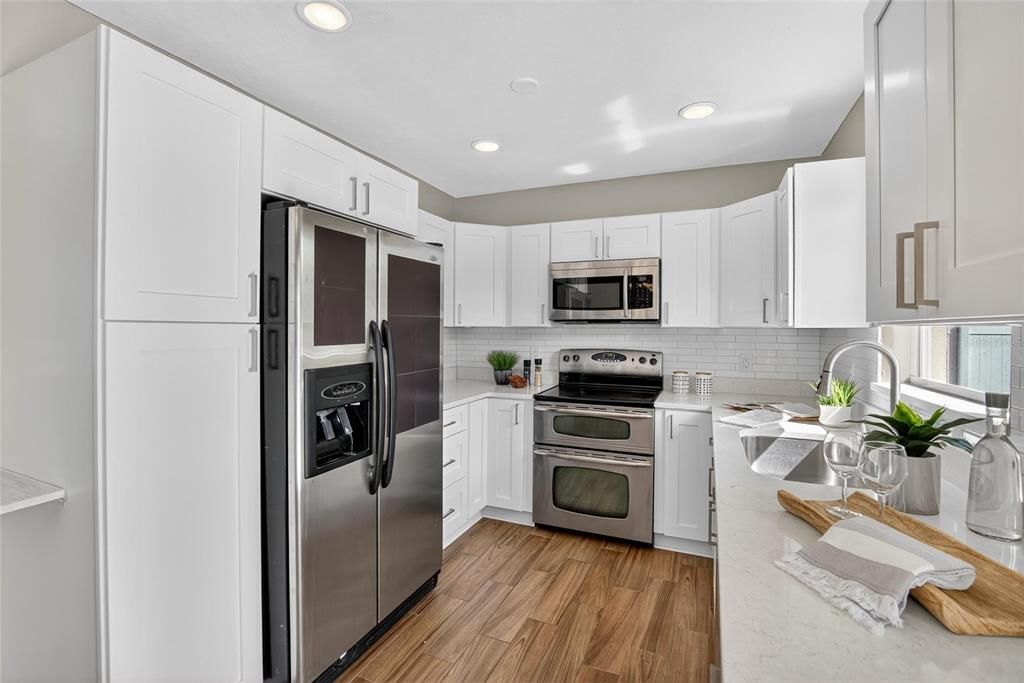 Interior, Kitchen, Recessed Lighting, Stainless Steel Appliances, Wood Texture Flooring