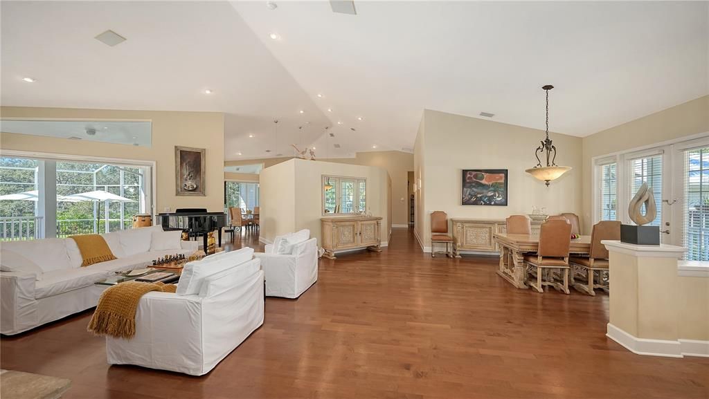 Dining room, Interior, Living room, Pendant Lights, Piano, Recessed Lighting, Wood Texture Flooring
