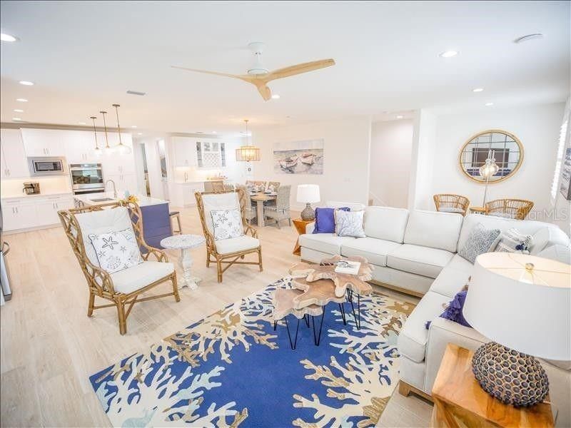 Chandelier, Dining room, Interior, Kitchen, Living room, Pendant Lights, Recessed Lighting, Stainless Steel Appliances, Wood Texture Flooring