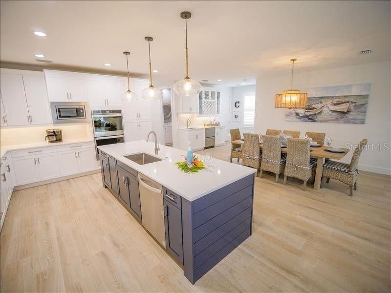Dining room, Interior, Kitchen, Pendant Lights, Recessed Lighting, Stainless Steel Appliances, Wood Texture Flooring