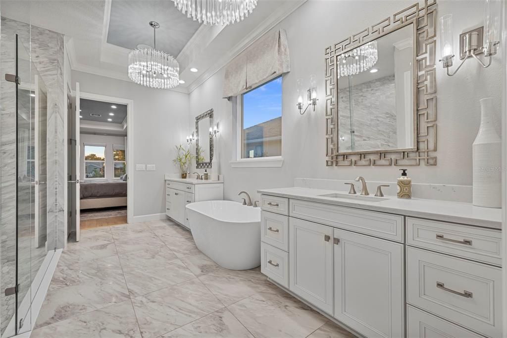 Bathroom, Chandelier, Dual Sink Vanities, Free Standing Baths, Glass Shower, Interior, Marble, Marble Walls, Recessed Lighting