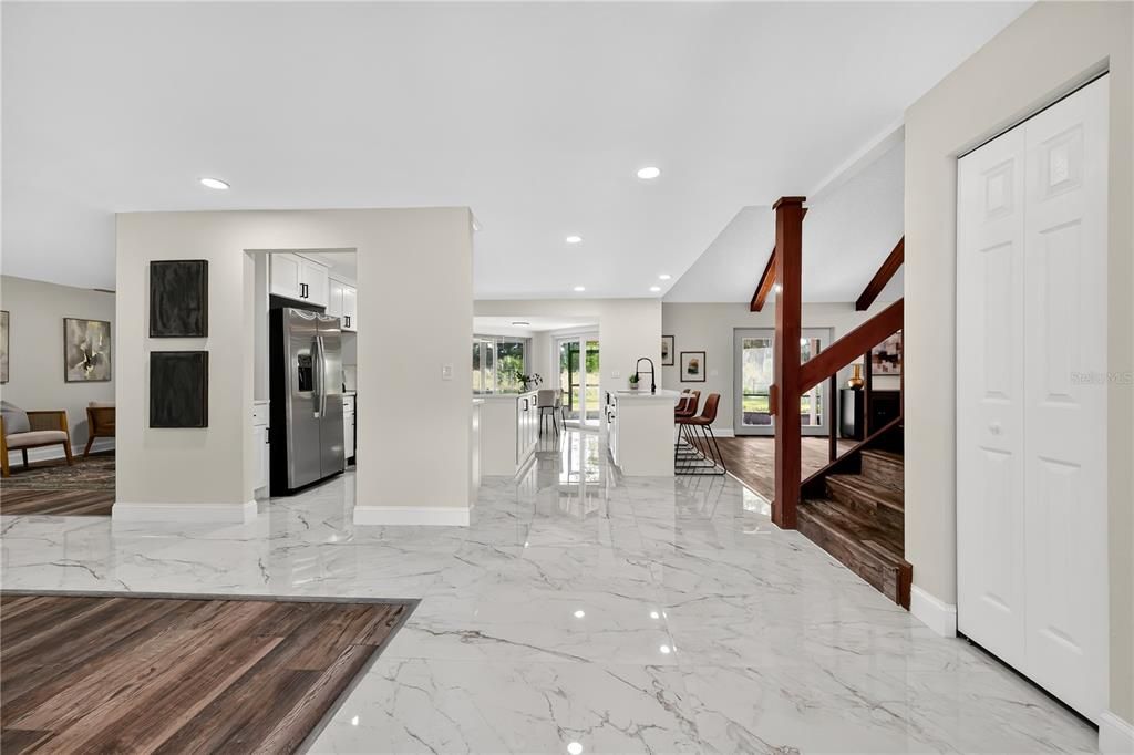 Dining room, Interior, Kitchen, Marble, Recessed Lighting, Stainless Steel Appliances, Wood Texture Flooring