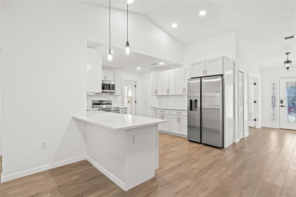 Interior, Kitchen, Pendant Lights, Recessed Lighting, Stainless Steel Appliances, Wood Texture Flooring
