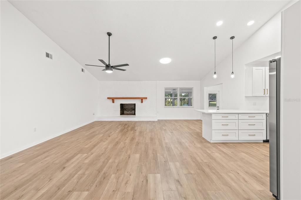 Empty room, Fireplace, Interior, Pendant Lights, Recessed Lighting, Wood Texture Flooring