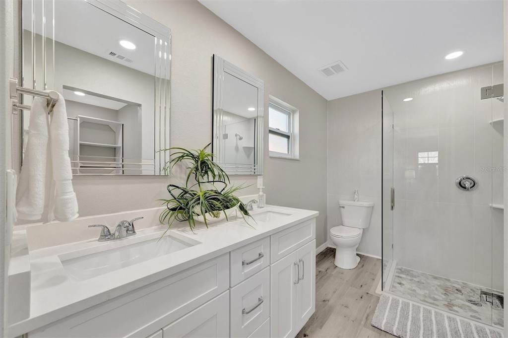 Bathroom, Dual Sink Vanities, Glass Shower, Interior, Recessed Lighting, Wood Texture Flooring
