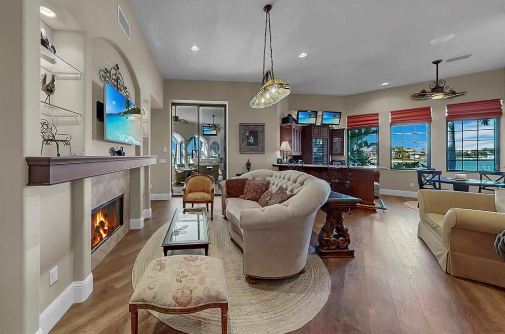 Dining room, Fireplace, Interior, Living room, Pendant Lights, Piano, Recessed Lighting, Water, Wood Texture Flooring