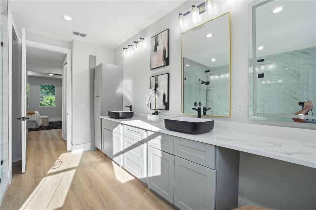 Bathroom, Dual Sink Vanities, Glass Shower, Interior, Marble Walls, Recessed Lighting, Wood Texture Flooring