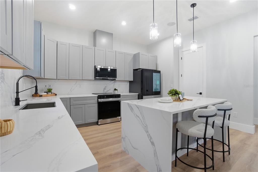 Interior, Kitchen, Marble Walls, Pendant Lights, Recessed Lighting, Stainless Steel Appliances, Wood Texture Flooring