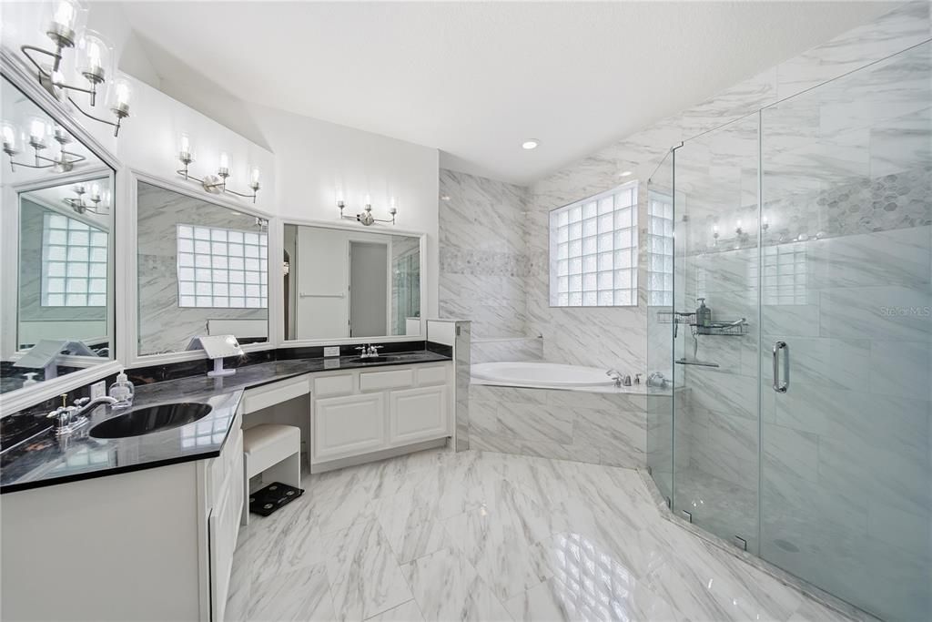 Bathroom, Dual Sink Vanities, Glass Shower, Interior, Marble, Marble Walls, Recessed Lighting