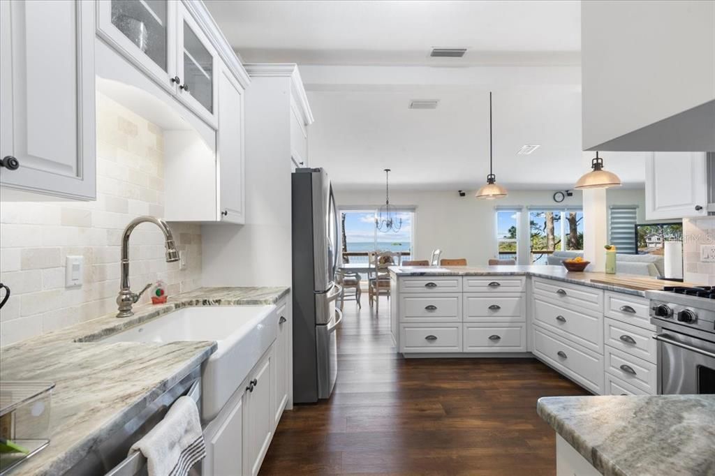 Chandelier, Dining room, Interior, Kitchen, Pendant Lights, Stainless Steel Appliances, Water, Wood Texture Flooring