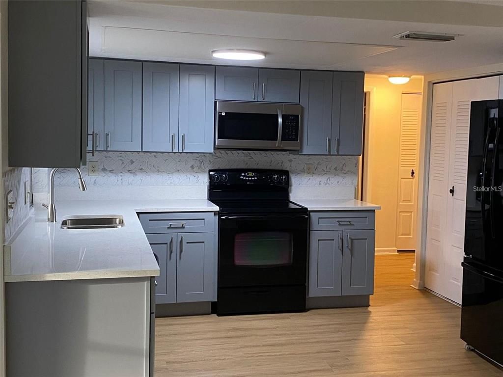 Interior, Kitchen, Marble Walls, Recessed Lighting, Wood Texture Flooring