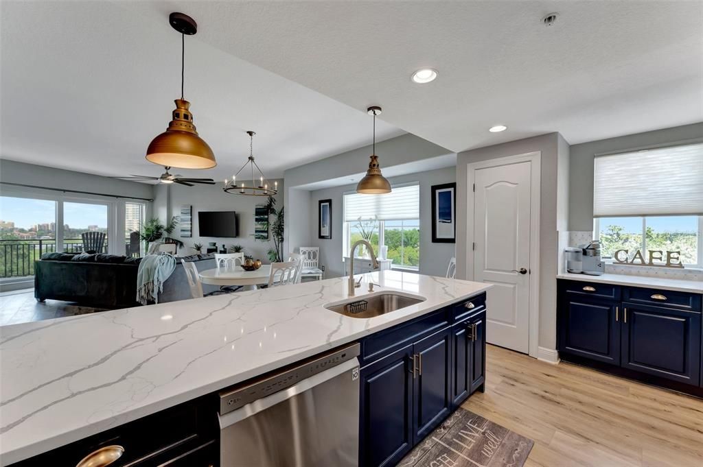 Dining room, Interior, Kitchen, Pendant Lights, Recessed Lighting, Stainless Steel Appliances, Wood Texture Flooring