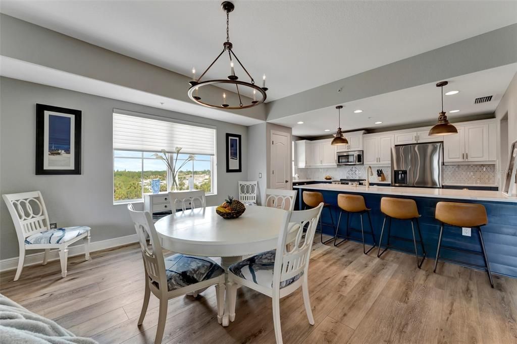 Dining room, Interior, Kitchen, Pendant Lights, Recessed Lighting, Stainless Steel Appliances, Wood Texture Flooring